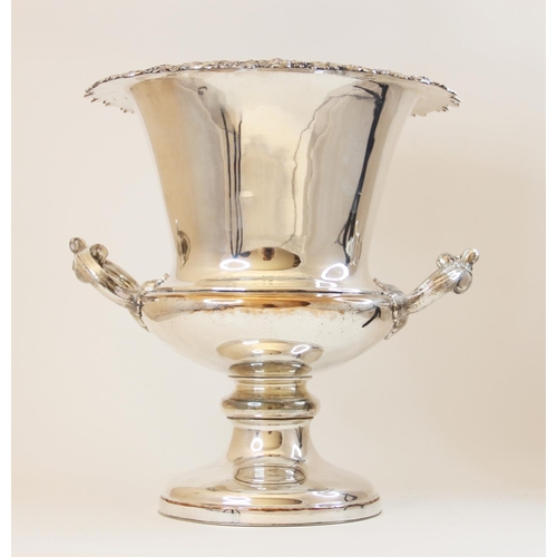 69 - A silver plated twin-handled campana wine cooler, with cast grape and vine rim on domed circular foo... 