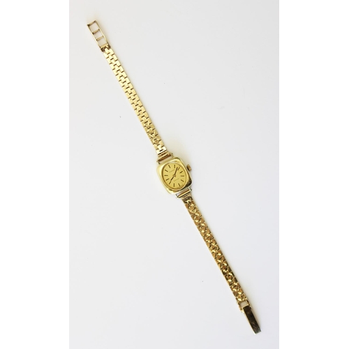 86 - A lady's vintage 18ct gold Tissot Saphir wristwatch, gold toned oval dial with baton markers, set to... 