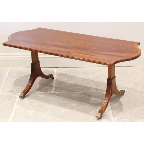 872 - A reproduction mahogany twin pedestal coffee table, by William Tillman, the shaped and cross banded ... 