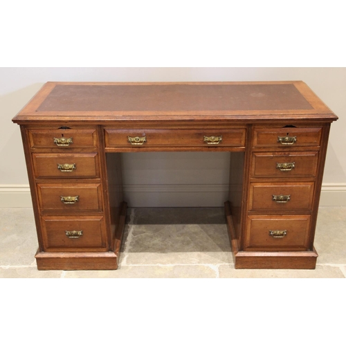 874 - An Edwardian mahogany twin pedestal writing desk, with a rectangular leather inset skiver, above a f... 