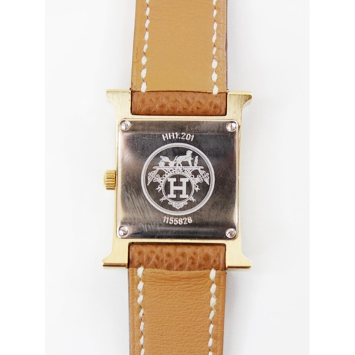 89 - A lady's Hermes Heure H gold plated stainless steel wristwatch, square white dial with Arabic numera... 