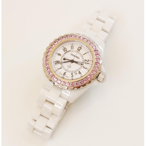 92 - A lady's Chanel 'J12' white ceramic quartz wristwatch, the white dial with Arabic numerals, luminous... 