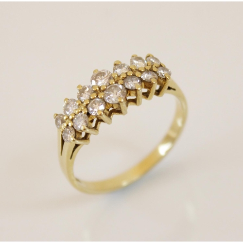 153 - A 18ct gold diamond set ring, comprising two rows of seven graduated round brilliant cut diamonds, (... 