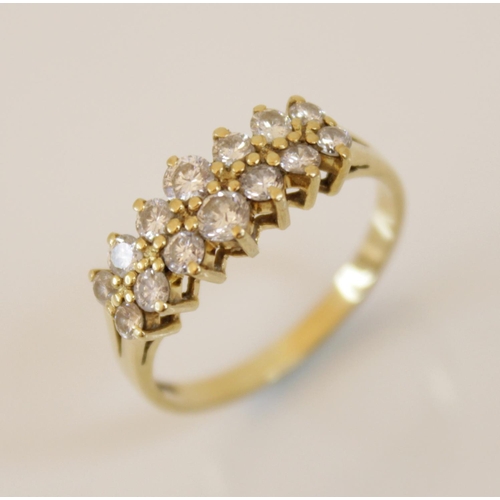 153 - A 18ct gold diamond set ring, comprising two rows of seven graduated round brilliant cut diamonds, (... 