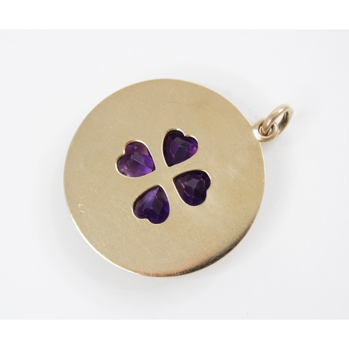 155 - A 14ct gold amethyst 'lucky' clover pendant, the central raised clover motif comprising four heart-s... 