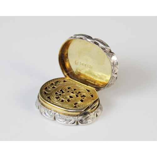 49 - A Victorian silver vinaigrette by Edward Smith, Birmingham 1856, of oval form with scalloped borders... 