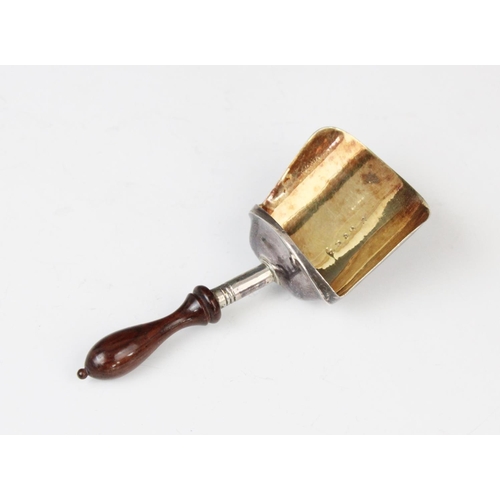 8 - A George III silver caddy spoon, Samuel Pemberton, Birmingham (date letter worn) with turned wooden ... 