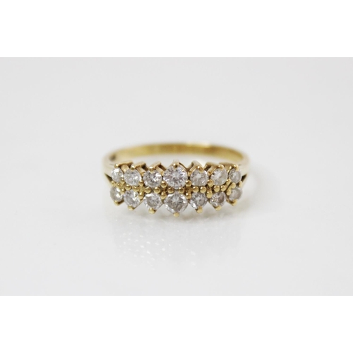 153 - A 18ct gold diamond set ring, comprising two rows of seven graduated round brilliant cut diamonds, (... 