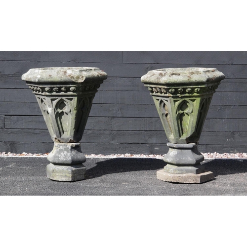 878 - A pair of Gothic sandstone planters, possibly converted from roof finials, each of hexagonal taperin... 