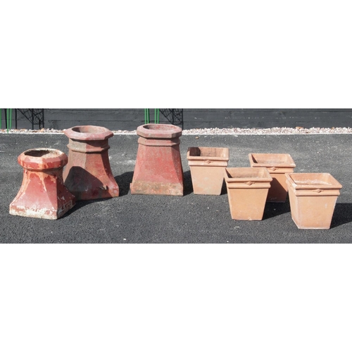 881 - A set of four terracotta stone planters, each of tapering square form, 28cm high, along with three v... 