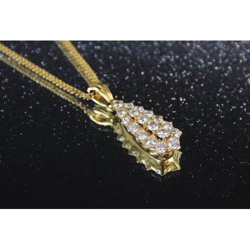 110 - A diamond teardrop pendant, comprising eighteen round brilliant cut diamonds, (estimated diamond wei... 