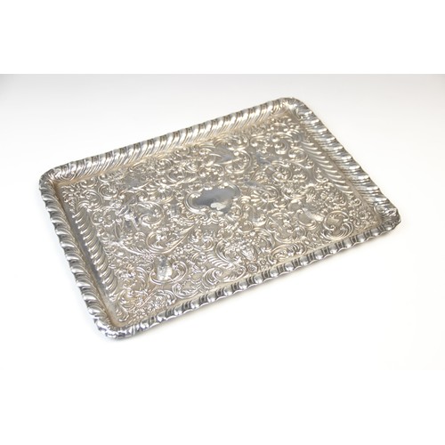 27 - A late Victorian silver tray by William Comyns, London 1898, of rectangular form with gadroon border... 