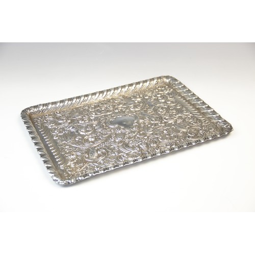 27 - A late Victorian silver tray by William Comyns, London 1898, of rectangular form with gadroon border... 