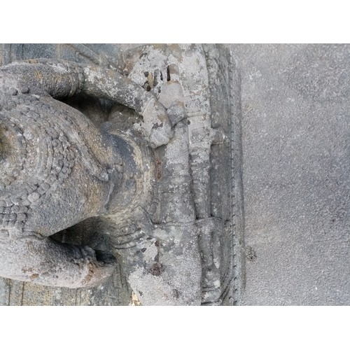 876 - A substantial 19th century carved stone architectural figure of Guanyin, modelled in a seated positi... 