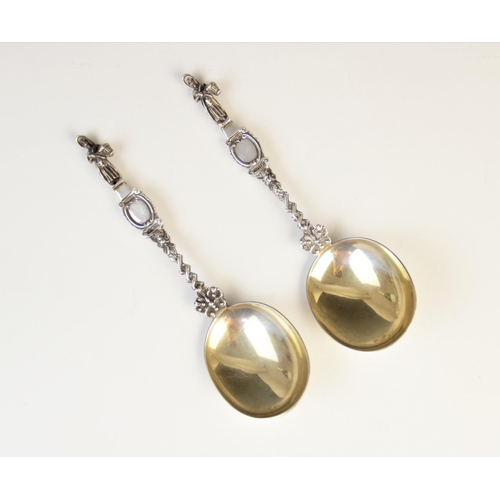 100 - A pair of Edwardian silver Dutch-style spoons by Holland, Aldwinckle & Slater, London 1906-7, each w... 