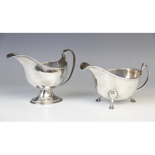 101 - A Victorian silver sauce boat by Thomas Hayes, Birmingham 1892, of helmet form on pedestal foot with... 