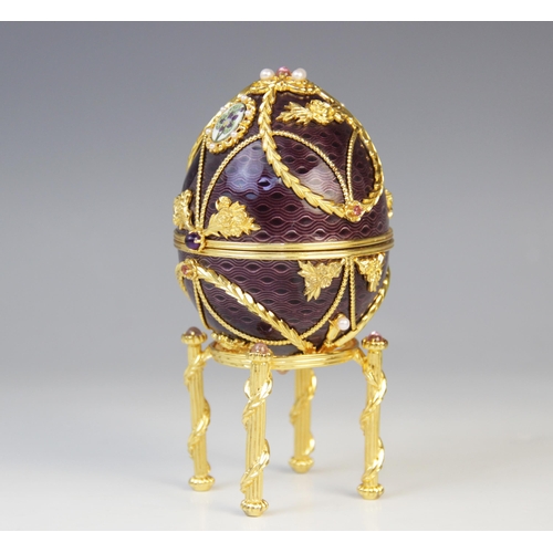 115 - A Frankin Mint 1984 House of Igor Carl Faberge Imperial Anniversary Egg, the silver egg with purple ... 