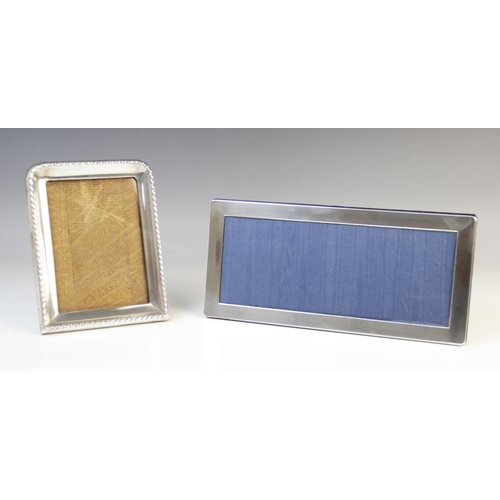 130 - A George V silver mounted photograph frame by Synyer & Beddoes, Birmingham 1920, of rectangular form... 