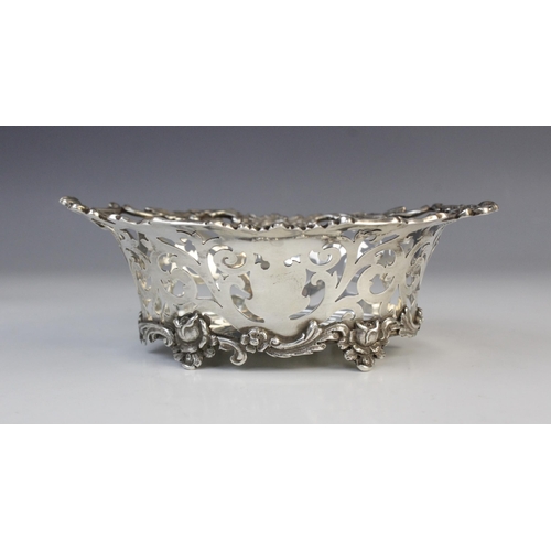 133 - An Edwardian silver bon-bon dish by Charles Wilkes, Birmingham 1910, of oval form with pierced scrol... 