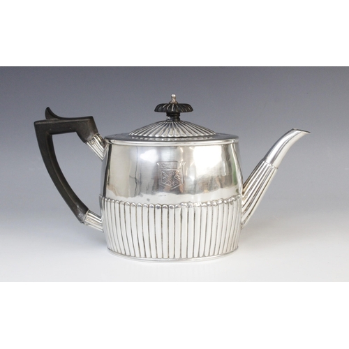 135 - A George III silver teapot by Michael Plummer, London 1793, of oval form with half-reeded decoration... 