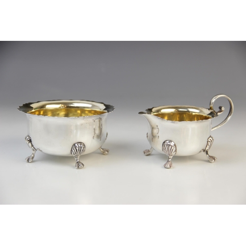 138 - An Edwardian silver sugar bowl and milk jug by J Sherwood & Sons, Birmingham 1904, each of circular ... 