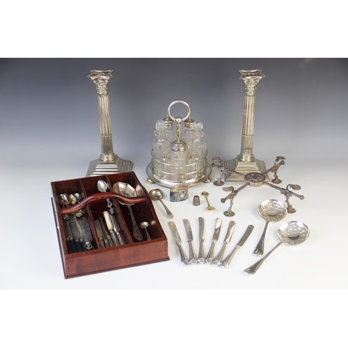 143 - A selection of silver plated tableware, to include: a pair of silver plated Corinthian column candle... 