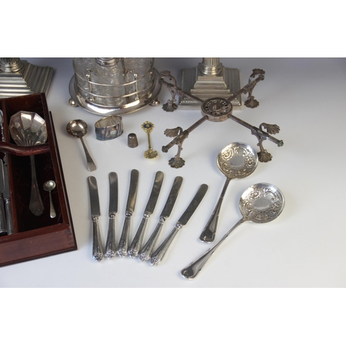 143 - A selection of silver plated tableware, to include: a pair of silver plated Corinthian column candle... 