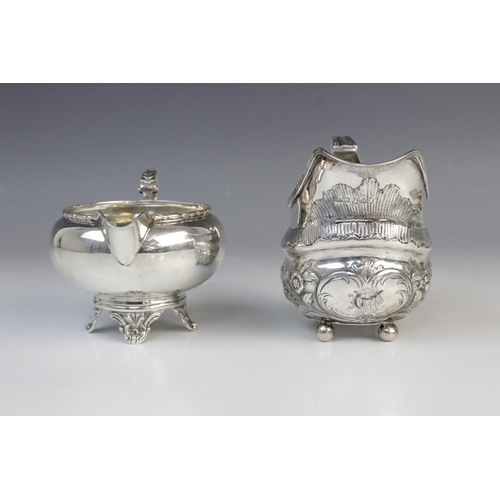 25 - A George III silver milk jug, maker’s marks for ‘ID’, London 1808, of oval baluster form on four bal... 