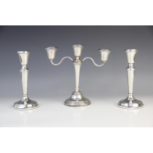 51 - A loaded silver three-branch candelabra by Elkington & Co, Birmingham 1967, with bell shaped sconces... 