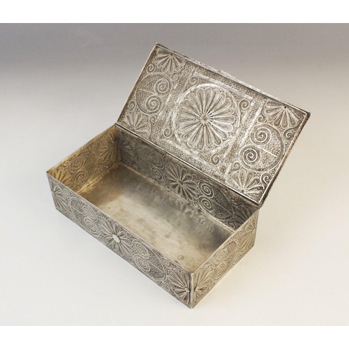 53 - An Indian white metal wirework casket, of rectangular form with hinged cover, decorated with scrolli... 