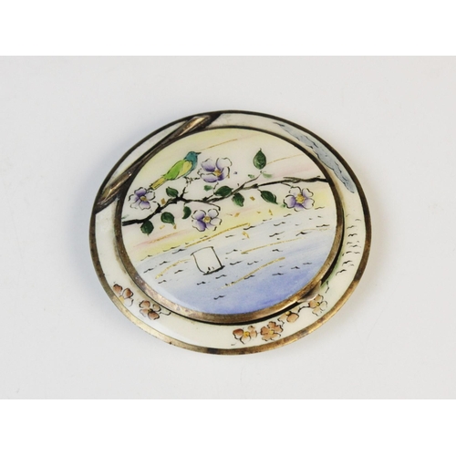 71 - An early 20th century Austrian silver and enamel compact, of circular form decorated in polychrome e... 