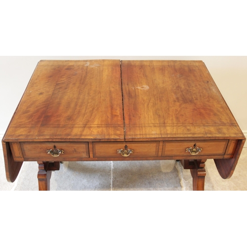827 - A Regency maple sofa table, in the manner of George Bullock, the rectangular top with rounded drop l... 