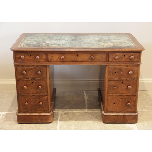 883 - A Victorian figured walnut twin pedestal desk, the rectangular thumb moulded top with rounded corner... 