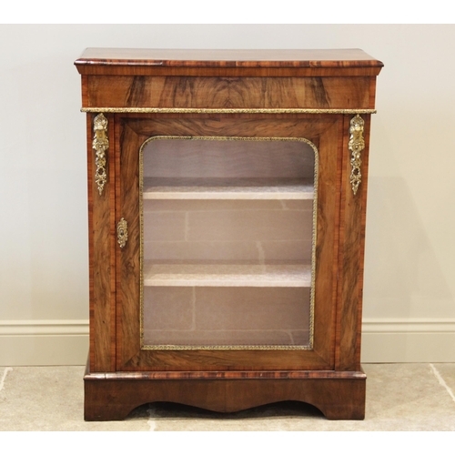 886 - A Victorian figured walnut pier cabinet, the rectangular moulded top above a plain frieze and a gilt... 