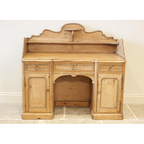 892 - A Victorian pine inverted breakfront washstand, the three quarter galleried top with a shaped back a... 