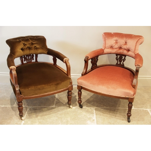 895 - A Victorian walnut and upholstered tub chair, the shaped button back upon three carved openwork spla... 