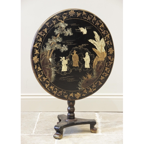 899 - A Victorian Japanned hardwood pedestal table, the circular tilt top with a gilt foliate trailing fri... 