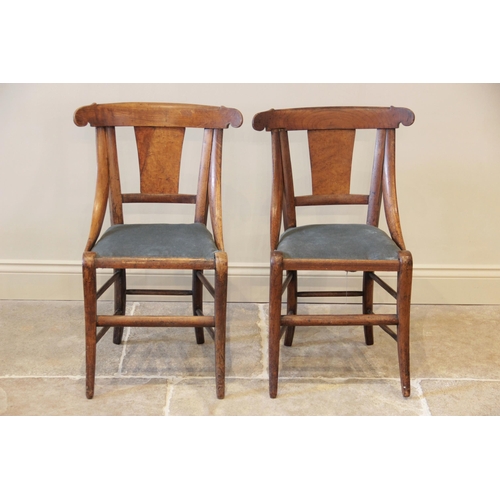 903 - A pair of maple side chairs in the manner of  Biedermeier, circa 1830, each chair with a concave top... 