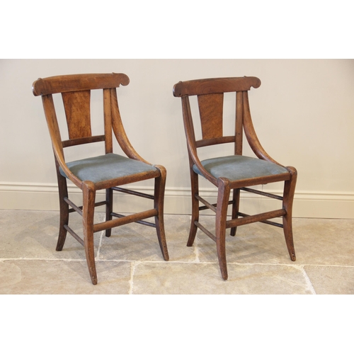 903 - A pair of maple side chairs in the manner of  Biedermeier, circa 1830, each chair with a concave top... 