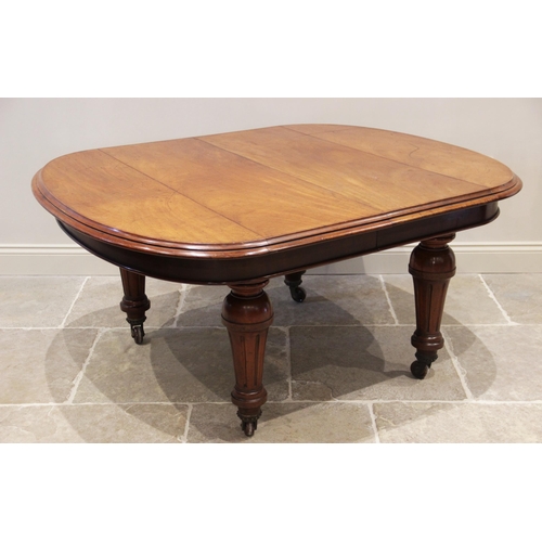 906 - A Victorian mahogany extending dining table, the oval table top with a moulded edge above a plain fr... 