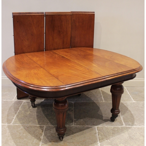 906 - A Victorian mahogany extending dining table, the oval table top with a moulded edge above a plain fr... 