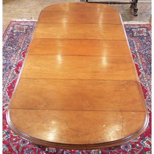 906 - A Victorian mahogany extending dining table, the oval table top with a moulded edge above a plain fr... 