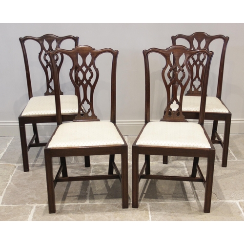 907 - A set of eight mahogany Chippendale style dining chairs, early 20th century, each chair with an inte... 