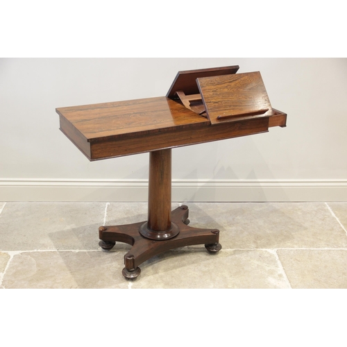 912 - A William IV rosewood reading/music table, the rectangular top with two opposing adjustable book res... 