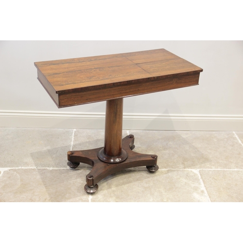 912 - A William IV rosewood reading/music table, the rectangular top with two opposing adjustable book res... 