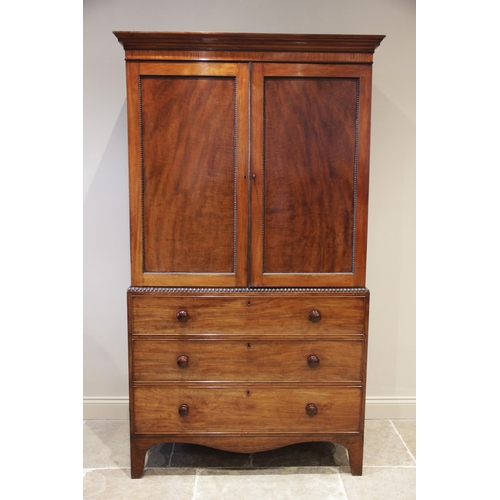 914 - A William IV mahogany, satinwood and ebonised linen press, with a cavetto cornice above a plain sati... 