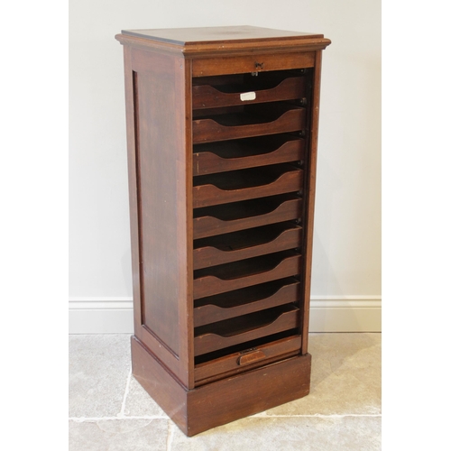 920 - An early 20th century walnut tambour front cabinet, the rectangular moulded top above a tambour fron... 