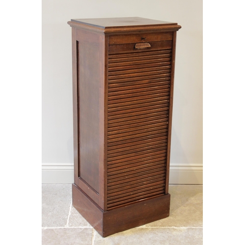 920 - An early 20th century walnut tambour front cabinet, the rectangular moulded top above a tambour fron... 