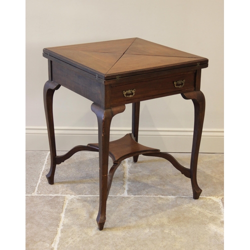 921 - An Edwardian mahogany envelope bridge table, the square quarter folding top above a single frieze dr... 