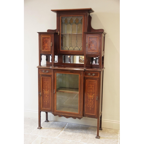 922 - An Edwardian inlaid mahogany display cabinet, the architectural high back formed with a central lead... 